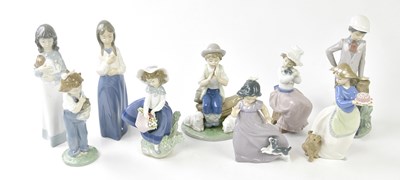 Lot 1235 - LLADRO; a figure of a girl holding a basket of...