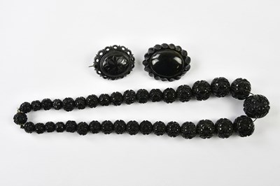 Lot 1154 - A 19th century carved jet necklace and two...