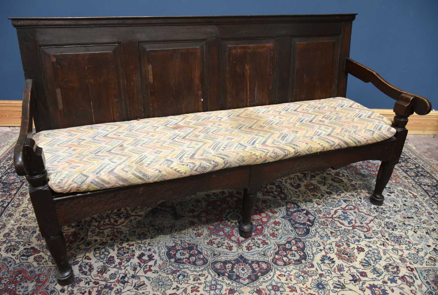 Lot 8 - An 18th century oak settle with four panel...
