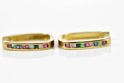 Lot 471 - A pair of yellow metal channel set hoop...