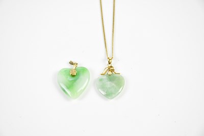 Lot 375 - Two jade heart shaped pendants, one with 14ct...