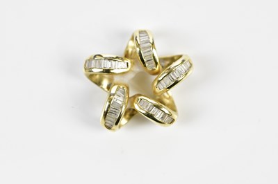 Lot 402 - A 14ct yellow gold and diamond set pendant in...