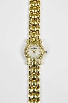 Lot 581 - BAUME & MERCIER; a lady's 18ct gold and...