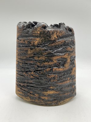 Lot 240 - A studio pottery vase with a rough textural...