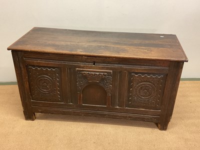 Lot 495 - A 19th century oak coffer, with three carved...