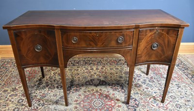Lot 56 - An Edwardian serpentine front mahogany...