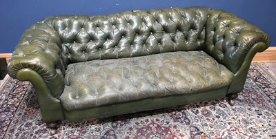 Lot 16 - A Victorian green leather Chesterfield sofa,...