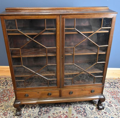 Lot 73 - A late 19th century mahogany bookcase with a...