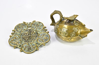 Lot 1354 - A Chinese cast brass teapot embossed with...