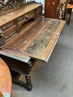 Lot 24 - A 19th century Flemish style carved oak desk...