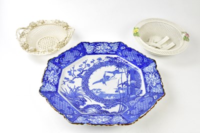 Lot 1279 - BELLEEK; a fine porcelain twin handled basket...