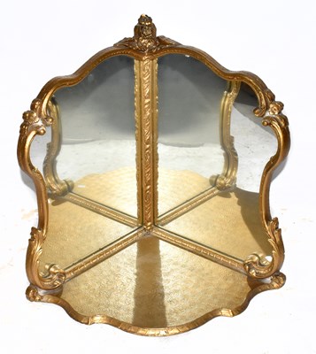 Lot 1548 - A decorative gilt mirrored corner shelf, in...