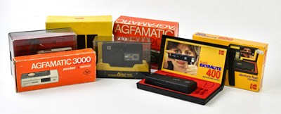 Lot 1429 - Seven film cameras in original boxes, to...