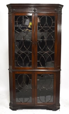 Lot 1522 - A George III mahogany freestanding corner...