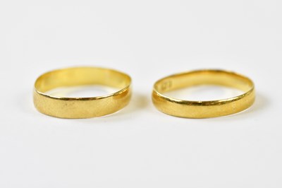 Lot 260 - Two 22ct yellow gold wedding bands, both...