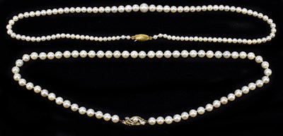 Lot 1407 - Two cultured pearl necklaces, one with 9ct...