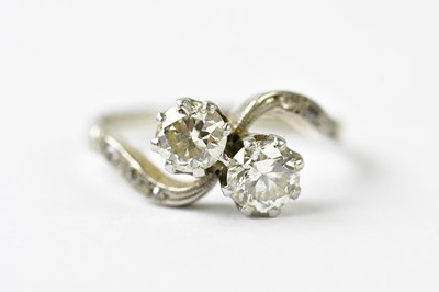 Lot 69 - An 18ct white gold diamond crossover, size L,...