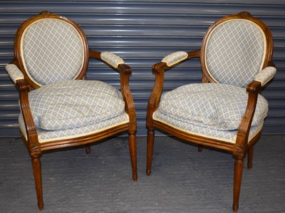 Lot 26 - A pair of reproduction French style open arm...