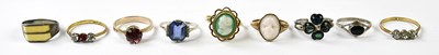 Lot 1132 - A 9ct yellow gold dress ring with carved stone...