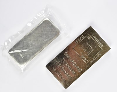 Lot 2195 - A one pound bar of titanium and another white...