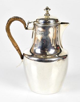 Lot 1026 - A George V hallmarked silver hot water pot of...