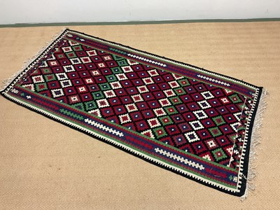 Lot 426 - A Kilim rug with geometric border and fringe,...