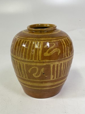 Lot 214 - An early 20th century slipware pottery vase...