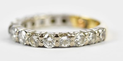 Lot 70 - A yellow and white metal diamond three-quarter...