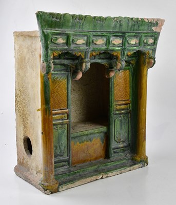 Lot 1336 - A Chinese Ming Dynasty sancai pottery shrine,...