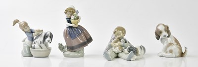 Lot 1257 - LLADRÓ; three figures and a model including a...