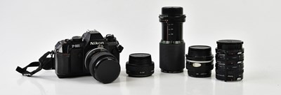 Lot 1405 - NIKON; a Nikon F-301 35mm film camera, togethr...