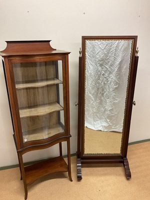 Lot 500 - An Edwardian floor standing mirror on castors,...
