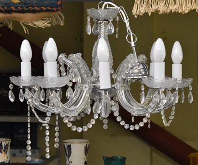 Lot 170 - A modern eight branch cut glass chandelier,...