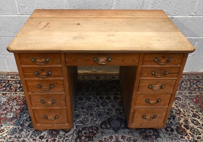 Lot 1681 - An Edwardian pine and pitch pine pedestal desk...