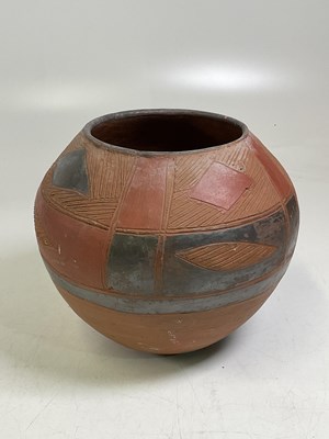 Lot 201 - An African painted terracotta globular pot...