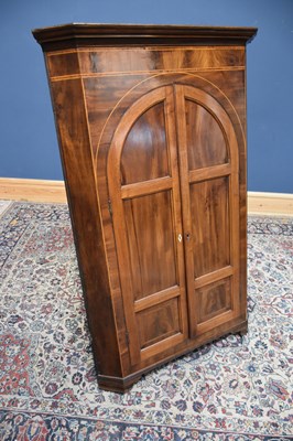 Lot 77 - A 19th century inlaid mahogany corner cupboard...