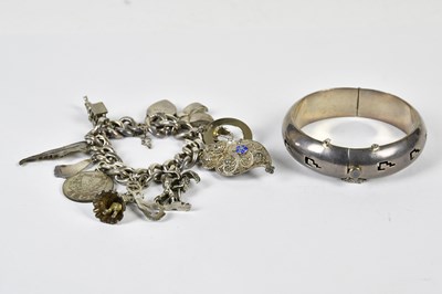 Lot 540 - A Mexican sterling silver snap bangle and a...