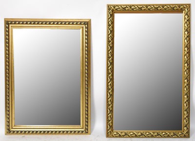 Lot 1456 - Two modern gilt composite wall mirrors, both...