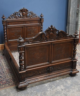 Lot 3 - A Victorian carved oak double bed, with...