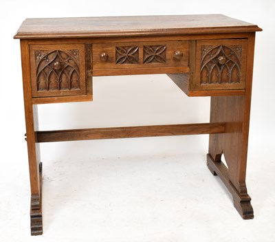 Lot 1737 - PRIORY; an oak writing table, with three...