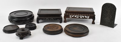 Lot 633 - A group of eight Chinese carved hardwood...