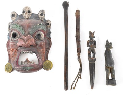 Lot 560 - An African painted tribal mask with small wax...