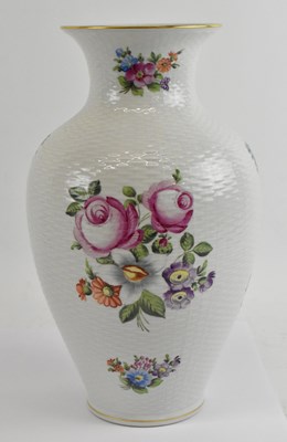 Lot 495 - HEREND; a large floral decorated white ground...