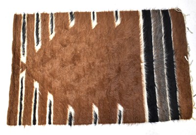 Lot 135 - A Nigerian goat hair hand-woven rug, cream,...