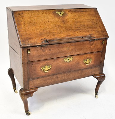 Lot 4 - A George III oak bureau of small proportions,...