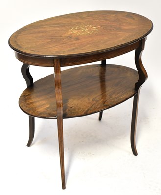 Lot 25 - An Edwardian walnut inlaid oval two-tiered...