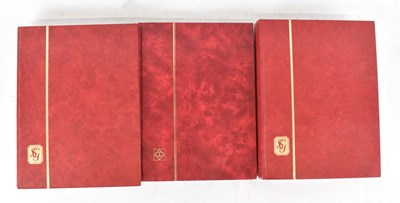 Lot 418 - A group of three thirty-two page stock books...