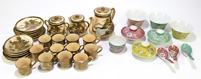 Lot 546 - A Japanese Satsuma part tea service, decorated...