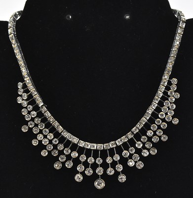 Lot 774 - A white metal Art Deco style frilled diamond...