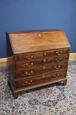 Lot 50 - A 19th century mahogany bureau, the fall front...